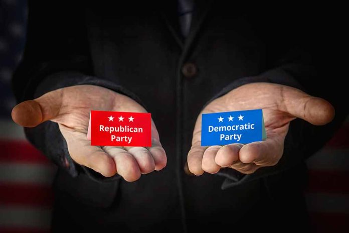 Hands holding Republican and Democratic Party cards.