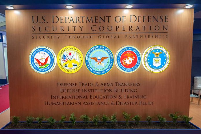 U.S. Department of Defense Security Cooperation display with logos.