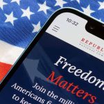 Smartphone and American flag promoting Republican National Committee.