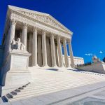 Supreme Court building with columns and detailed pediment.