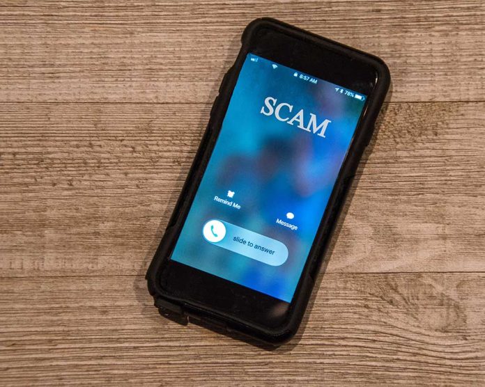 Phone with SCAM Written on the screen and an incoming call