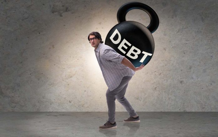 Man carrying the weight of debt