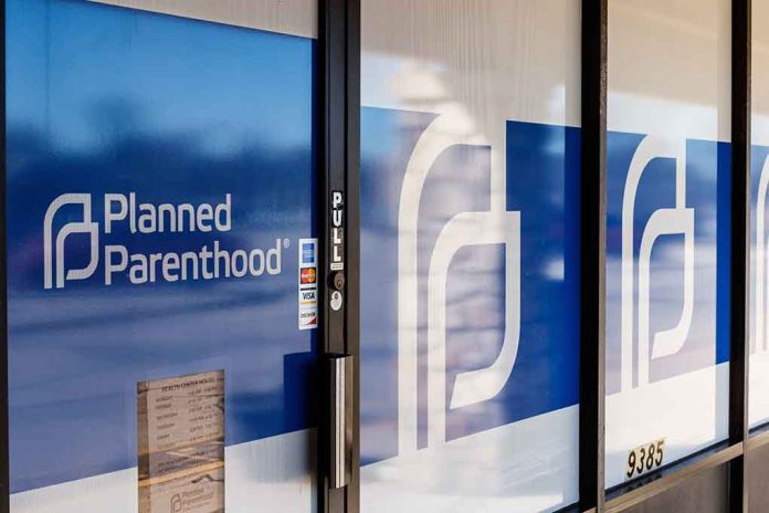 Planned Parenthood office entrance with logo and signs.