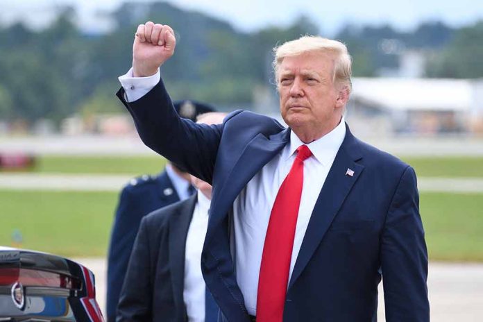 Man in suit raising fist outdoors at event