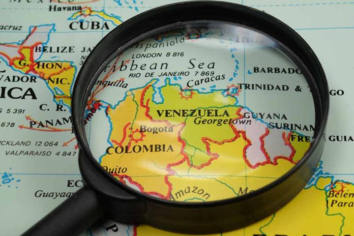 Magnifying glass over a map of Venezuela.