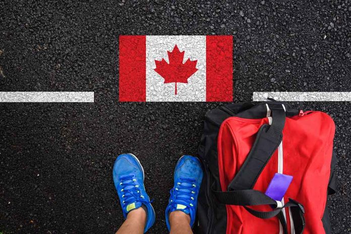 Shoes and bag beside painted Canadian flag.