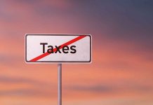 Sign with the word Taxes crossed out