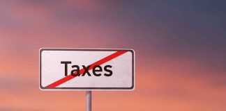 Sign with the word Taxes crossed out