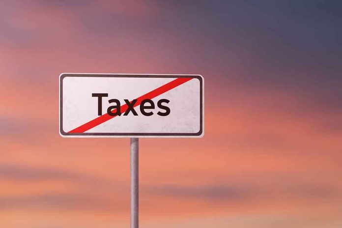 Sign with the word Taxes crossed out