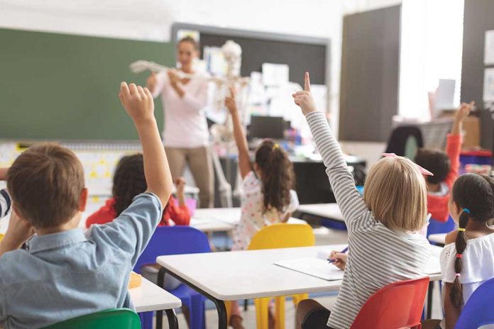 1352177357 featured image Children raising hands in classroom