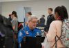 TSA agent checks passenger documents at airport security