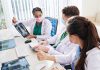 Doctors discussing chest Xray results at a workstation