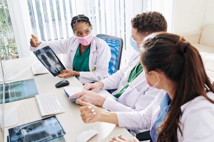 1779923279 featured image Doctors discussing chest Xray results at a workstation
