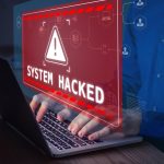 Warning sign System Hacked on laptop screen