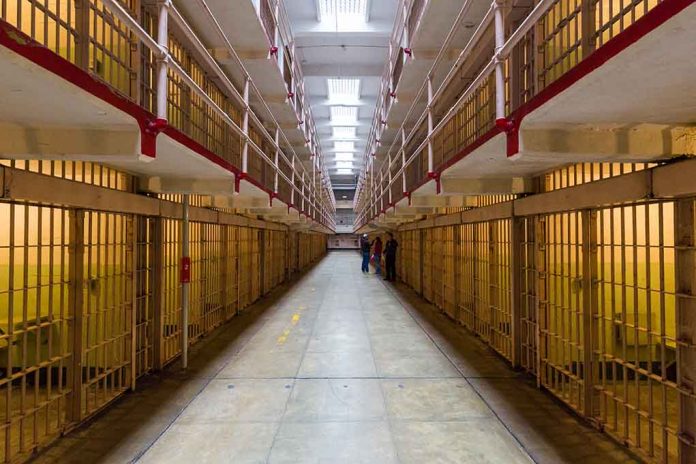372127549 featured image Long hallway with prison cells on both sides.