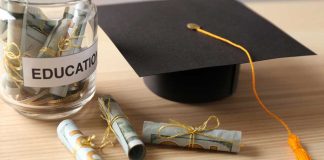 Graduation cap with money rolls and jar labeled Education