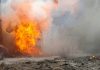 A large explosion with flames and smoke