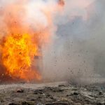 A large explosion with flames and smoke