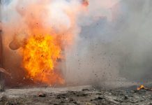 A large explosion with flames and smoke