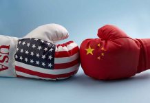 USA and China boxing gloves facing each other