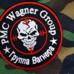 PMC Wagner Group patch on camouflage background