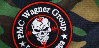 PMC Wagner Group patch on camouflage background