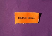 Product Recall text on orange paper purple background