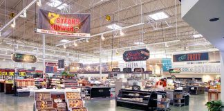 Supermarket interior with various food sections and displays