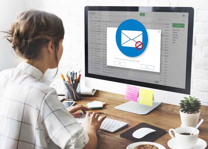 524195053 featured image Person viewing email error on desktop computer screen