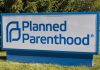 Planned Parenthood sign on a grassy lawn
