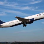 Delta airplane taking off from runway