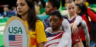 USA gymnasts waiting in line at an event.