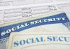 Social security cards on top of tax documents