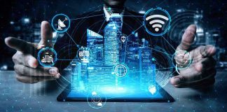 Holographic city above tablet with technology icons