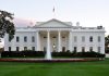The White House with fountain and American flag