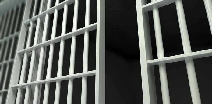 161438378 Close-up of prison cell bars