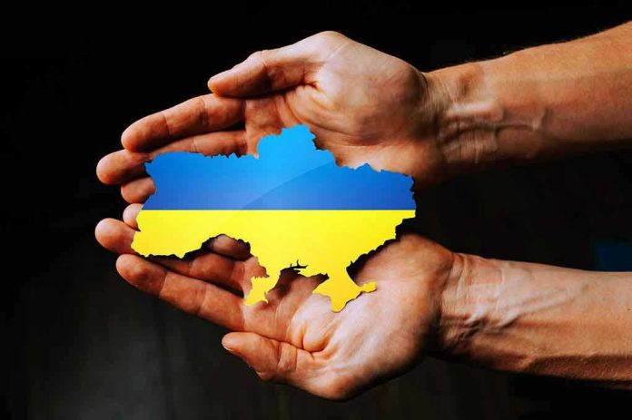 2129047880 Hands holding Ukraine map with flag design