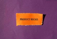 "Product Recall" text on orange paper, purple background.