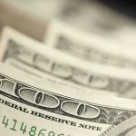 Closeup of stacked one hundred dollar bills