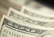 Closeup of stacked one hundred dollar bills