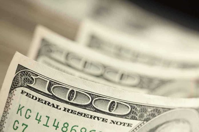 Closeup of stacked one hundred dollar bills