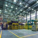 Interior view of a modern industrial facility with manufacturing equipment