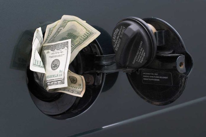 Cash sticking out of a car's gas tank