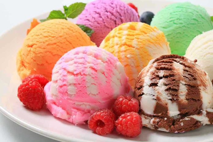 122596918 Assorted ice cream scoops with raspberries on a plate.