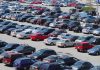 A crowded parking lot filled with various cars