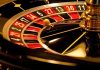 Close up of a roulette wheel with a spinning ball