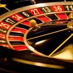Close up of a roulette wheel with a spinning ball