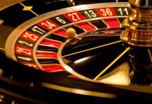 Close up of a roulette wheel with a spinning ball