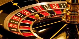 Close up of a roulette wheel with a spinning ball