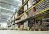 Interior view of a warehouse with stacked shelves of packaged goods